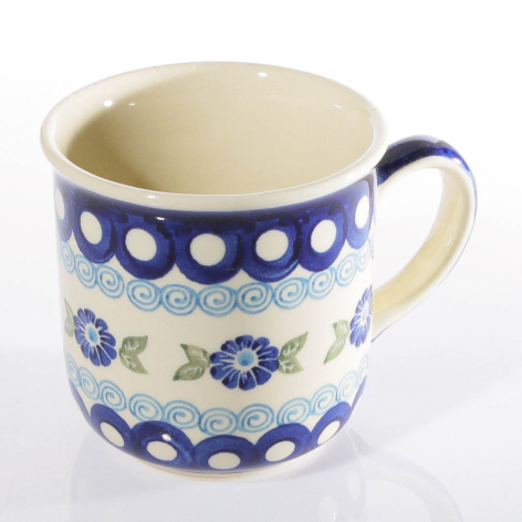 Blue and cream ceramic mug with hand-painted floral patterns and dotted bands, front view