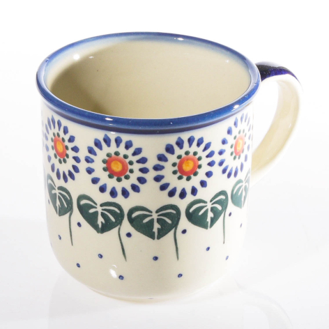 Cream ceramic pitcher with blue rim and hand-painted floral motifs in orange and blue, front view
