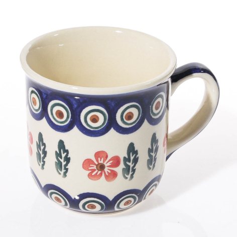Blue and cream ceramic mug with hand-painted floral and geometric patterns, front view