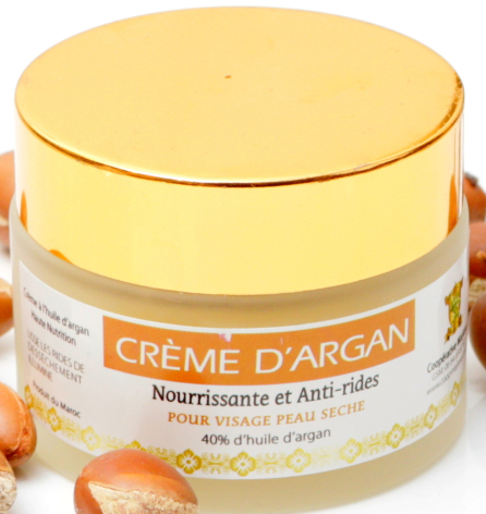 Yellow argan cream jar with orange label, front view showing round lid and product packaging