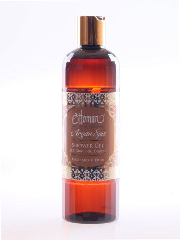 Amber glass bottle with dark brown label and spray top, front view against white background