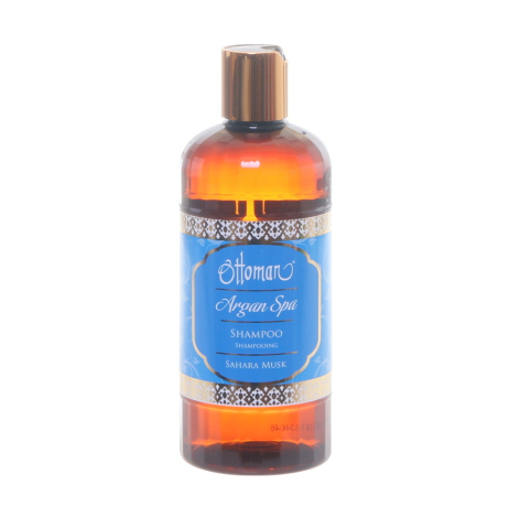 Amber glass argan oil bottle with blue label and bronze-toned pump dispenser, front view