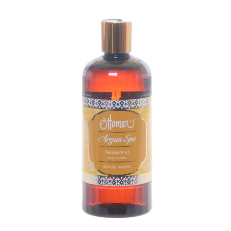 Amber argan oil bottle with brown label and copper-colored cap, displayed against white background