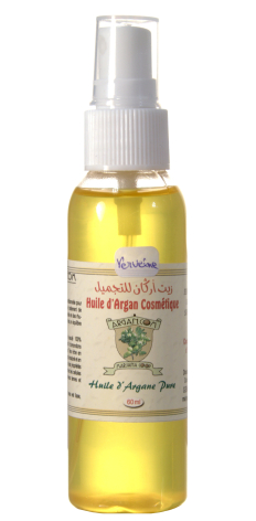 Golden yellow body oil in clear spray bottle with white pump top and tan label, front view