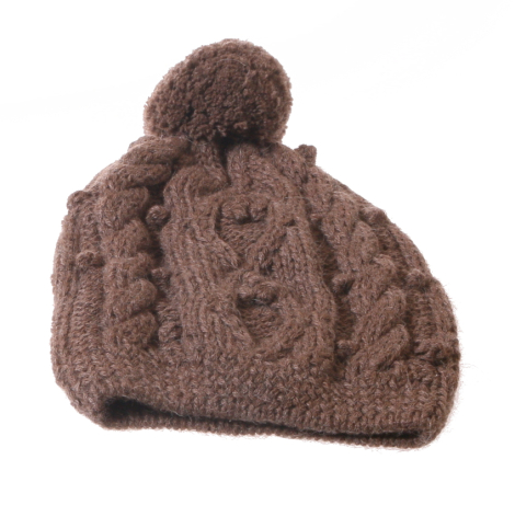 Brown knit beanie with cable pattern and pom-pom, front view against white background
