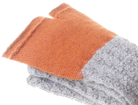 Stacked folded textiles in orange and grey, showing woven fabric texture in close-up view