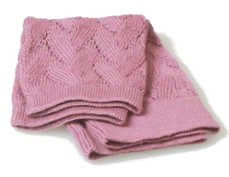 Folded pink textile with quilted diamond pattern detail, viewed from above