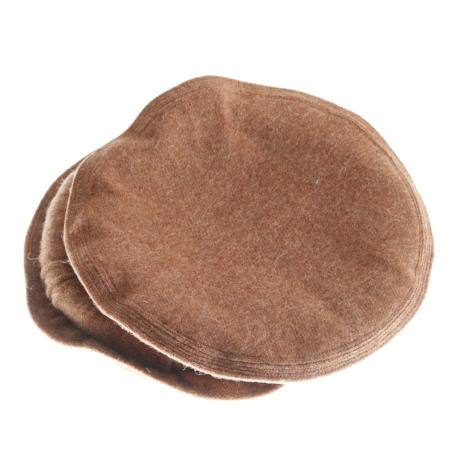 Taupe suede flat cap shown from above at a slight angle, revealing rounded crown and curved brim construction