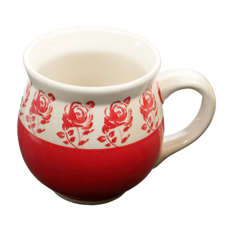 Red ceramic mug with cream-colored band featuring floral rose pattern, front view