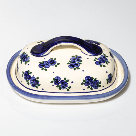 Navy and white ceramic butter dish with blue floral pattern and arched lid, top view