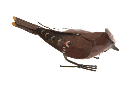 Brown leather bird sculpture with outstretched wings and thin metal legs, displayed in side profile view