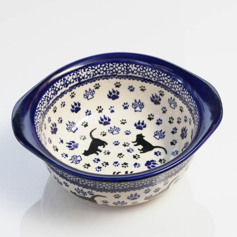 Deep blue and cream ceramic bowl with dotted pattern, angled top view showing interior detail