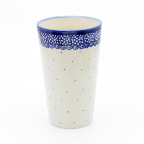 Tall cream ceramic mug with deep blue decorative band and dotted pattern around rim, front view