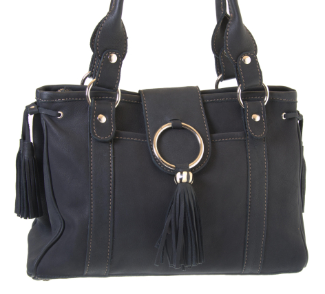 Black leather handbag with dual handles, front ring detail, and tassel accent, front view