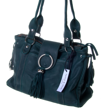 Dark blue leather handbag with dual handles, decorative tassel, and silver ring detail on front