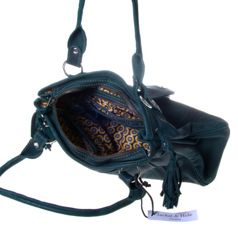 Black leather shoulder bag with copper embroidery, open to show interior, dual handles and adjustable strap