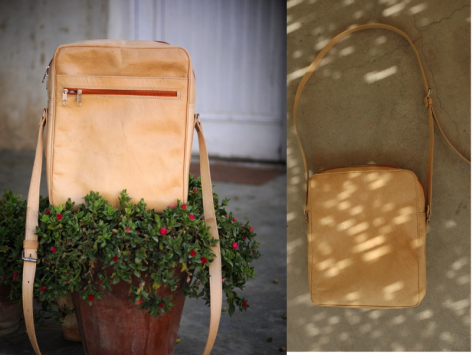Tan leather backpack with flap closure, front view and back view showing structured rectangular shape and worn patina