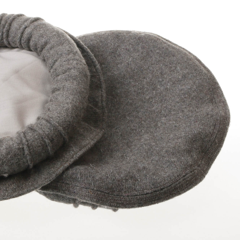 Grey wool boot with gathered cuff detail, viewed from above at an angle showing the textured fabric and white lining