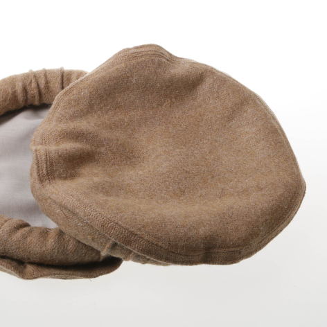 Beige leather pouch with soft gathered closure shown from above against white background