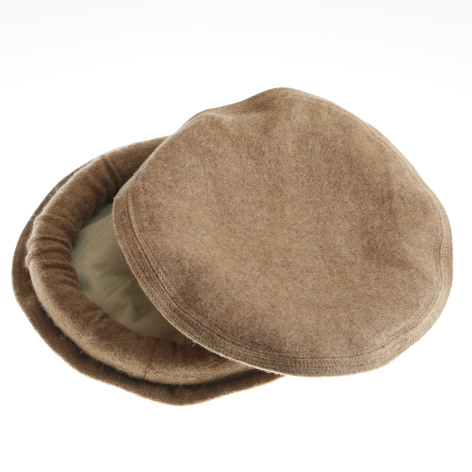 Beige linen pouches stacked at an angle, showing rounded flat shape and layered construction from above