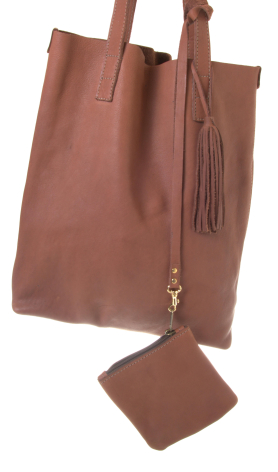 Rust-brown leather tote bag with rolled handles shown front view alongside a matching square pouch below