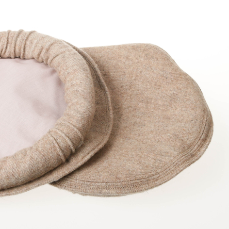 Beige linen slippers with soft cushioned sole, shown open and stacked in front view
