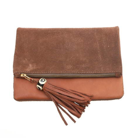 Brown leather fold-over clutch with suede flap detail and decorative tassel accent, front view