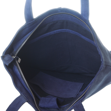 Navy blue leather tote bag open from above, showing deep interior compartment and dual handles