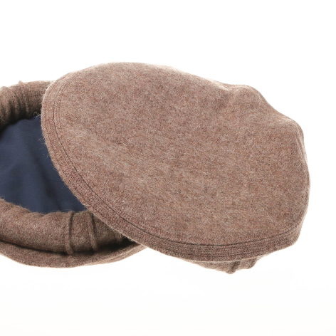 Beige and charcoal wool ear warmers with soft fleece lining, angled view showing curved shape