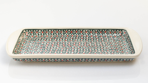 Rectangular brass tray with intricate hammered geometric pattern and raised silver-colored rim, viewed from above