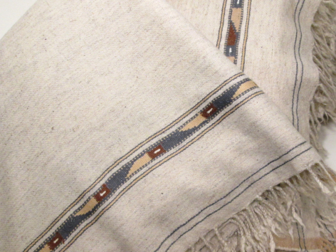 Cream colour patu with tribal pattern