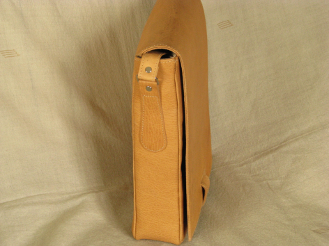 Tan leather shoulder bag with dark stripe detail, shown in side profile view