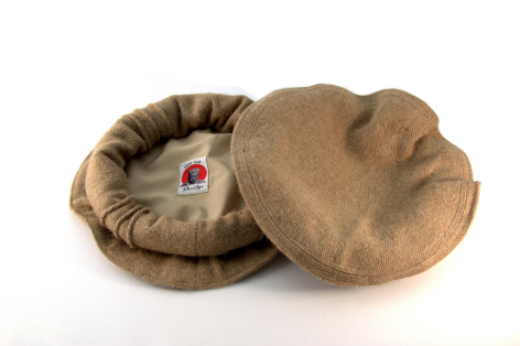 Deux paniers ronds en tissu naturel beige, l'un ouvert montrant l'intérieur, vus de dessus sur fond blanc
