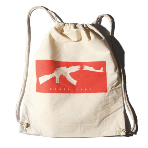 Sac à dos beige en coton avec détail rouge et blanc, cordon de serrage, vue de face