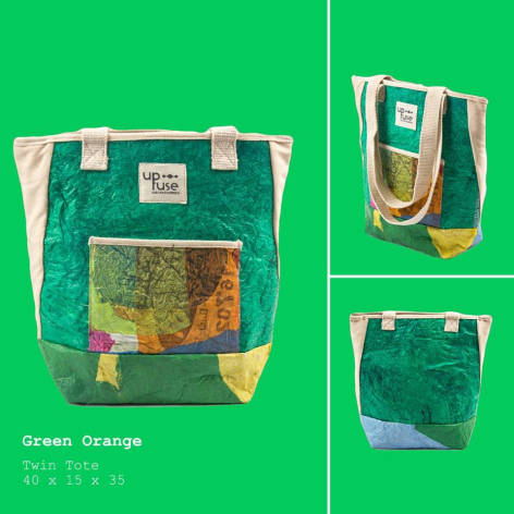 Green canvas backpack with tan leather accents and patterned front pocket, shown from front and side angles