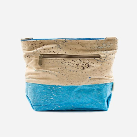 Fabric storage basket with natural woven top section and bright blue bottom, featuring rolled fabric handles