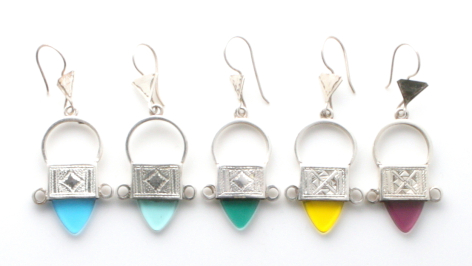 Five gemstone drop earrings with silver tops in blue, turquoise, green, yellow, and purple stones