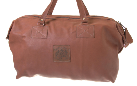 Brown leather weekender bag with dual handles, front view showing structured rectangular shape and small patch detail