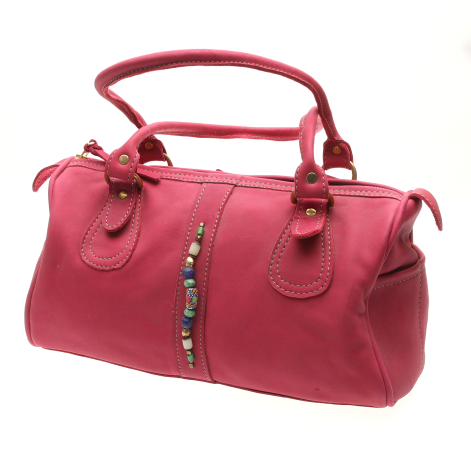 Deep red leather barrel bag with dual handles and decorative side tassel, angled front view