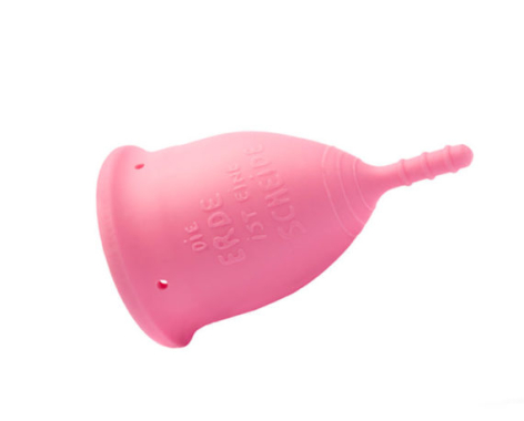 Bright pink silicone measuring cup with rounded bulbous body and tapered pouring spout, front view