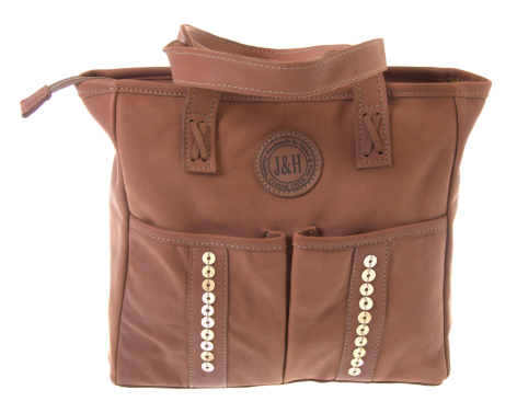 Tan leather backpack with rolled top closure, front pockets, and dual handles, front view