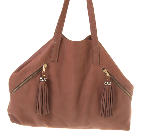 Terracotta leather tote bag with dual handles and decorative tassel zipper pockets on front, front view