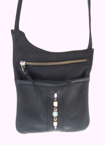 Black leather crossbody bag with gold zip detail and adjustable shoulder strap, front view