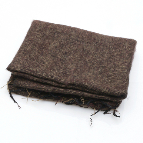 Brown linen textile folded with drawstring closures at corners, displayed flat from above