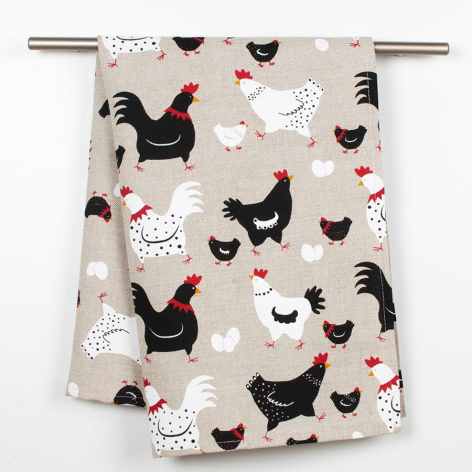 Beige cotton textile with playful black and white chicken print, displayed on hanging rod