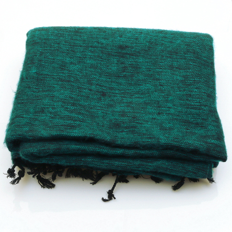 Teal-green woven textile with dark tassel fringe along bottom edges, flat lay view