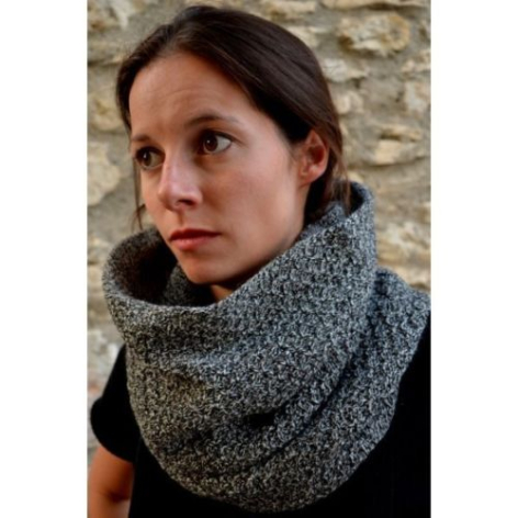 Woman wearing a charcoal grey knitted wool cowl neck scarf with textured knit pattern around her shoulders
