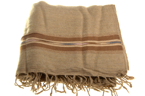 Beige linen throw with rust stripe and knotted fringe ends, folded flat view