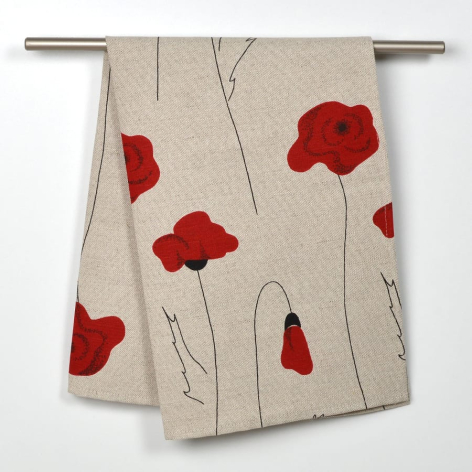 Cream textile with red poppy flower design, draped on hanging rod to display woven pattern