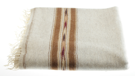 Cream wool throw with brown and tan stripes down the center, fringed edges, folded view